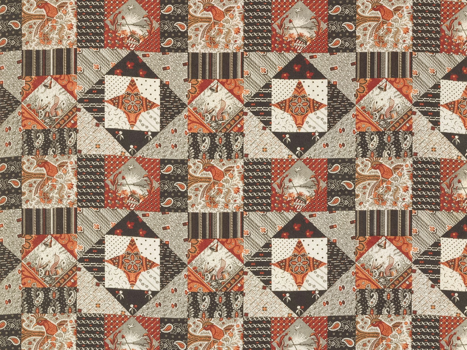 Geometric star quilt in warm orange, brown and cream